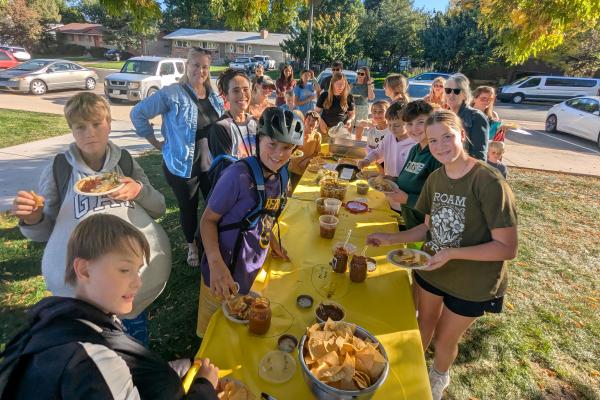 A group of students and parents at O'Dea's Garden Salsa Party after school with all kinds of salsa and chips for the contest.