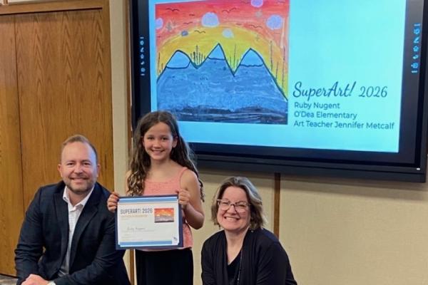 superintendent kingsley, female student, art teacher acceptiing PSD Super Art Award with artwork displayed on screen