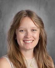 headshot - female teacher smiling long light brown hair 