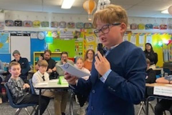 don quixote trial simulation - one student stadning in black robe, several seated at desks