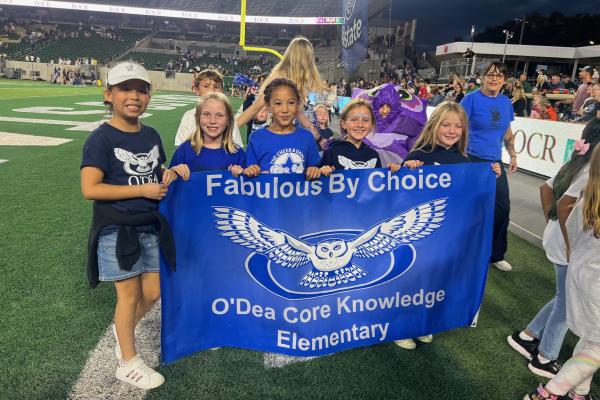 O'Dea Students and Owl mascot at CSU/PSD Canvas Community Football Game at Canvas Stadium